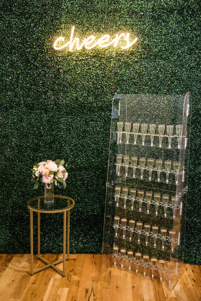 Champaign wall with neon sign